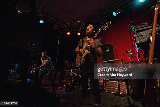 Bassist Roger Dabbs and singer/guitarist Matt Pelham of the Features perform during an EndSession hosted by 107.7 The End at the J&M Cafe on...