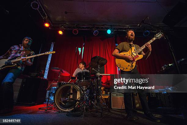 Bass player Roger Dabbs , drummer Rollum Haas and singer Matt Pelham of the Features perform during an EndSession hosted by 107.7 The End at the J&M...