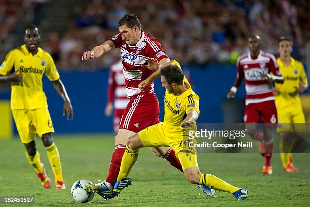 Kenny Cooper of FC Dallas fights for control of the ball with Chad Barson of the Columbus Crew on September 29, 2013 at Toyota Stadium in Frisco,...