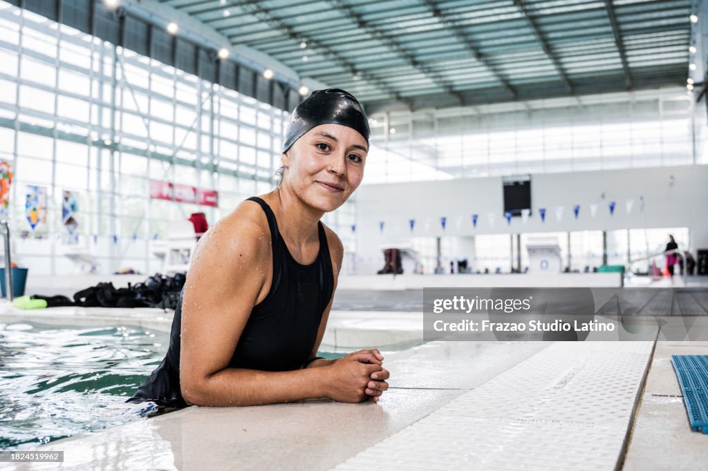 Portrait of a female swimmer at the poolside