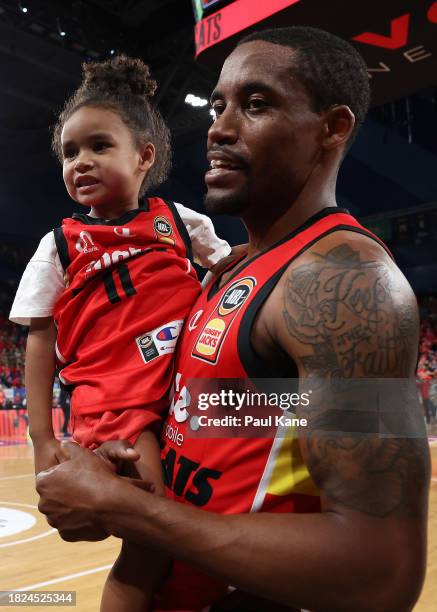 Bryce Cotton of the Wildcats looks on with his daughter after winning the round nine NBL match between Perth Wildcats and Sydney Kings at RAC Arena,...