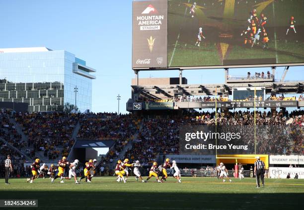 Wide angle view of the football action on the field during the University of Arizona Wildcats versus the Arizona State Sun Devils football game at...