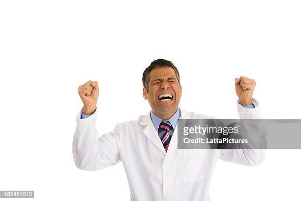 hispanic mann trägt laborkittel gestikulieren zwei fäuste in der luft - doctor lab coat stock-fotos und bilder