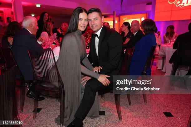 Super model Adriana Lima and Andre Lemmers during the 15th Mon Cheri hosts Barbara Tag at Isarpost on December 4, 2023 in Munich, Germany.