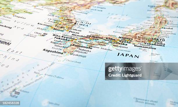 closeup of a world map of japan - kyushu stockfoto's en -beelden