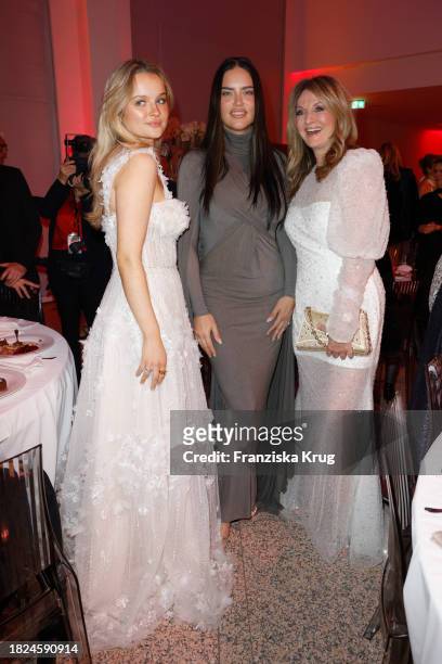Nele Ludowig, Adriana Lima and Frauke Ludowig during the Mon Cheri Hosts Barbara Tag at Isarpost on December 4, 2023 in Munich, Germany.