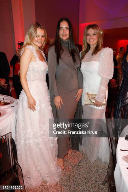 Nele Ludowig, Adriana Lima and Frauke Ludowig during the Mon Cheri Hosts Barbara Tag at Isarpost on December 4, 2023 in Munich, Germany.