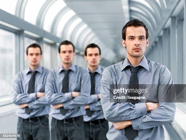 businessman and clones - klonen stockfoto's en -beelden