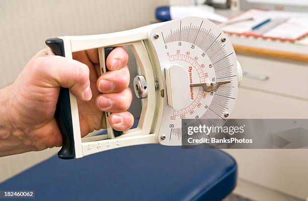 dynamometer hand grip strength test - clenched stock pictures, royalty-free photos & images