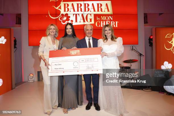 Maria Furtwängler, Adriana Lima, Carlo Vassallo, CEO Ferrero Deutschland, and Frauke Ludowig during the Mon Cheri Hosts Barbara Tag at Isarpost on...