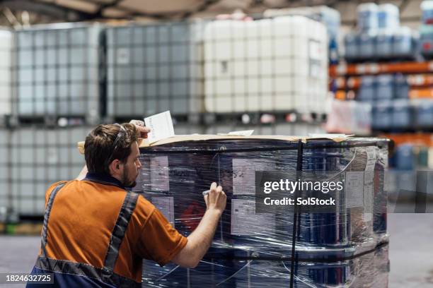 preparing the shipment for delivery - strap stock pictures, royalty-free photos & images
