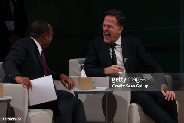 Abiy Ahmed Ali , Prime Minister of Ethiopia, and Dutch Prime Minister Mark Rutte share a laugh before speaking at day one of the high-level segment...
