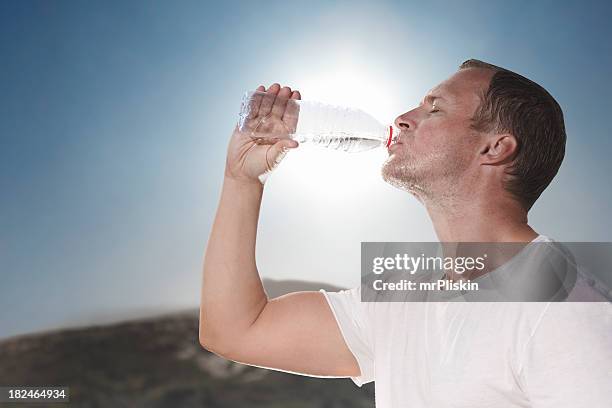 hot sunny day drinking water from a bottle - thirsty stock pictures, royalty-free photos & images