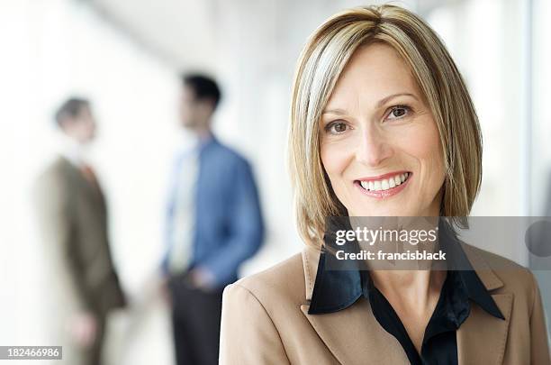 smiling modern executive businesswoman - president and ceo of smiles co masamichi toyama interview stockfoto's en -beelden