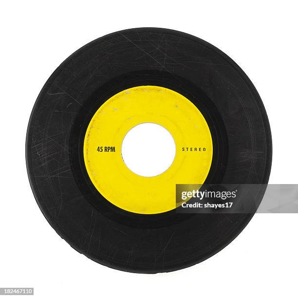 yellow and black 45 music record with scratches - black hole 個照片及圖片檔