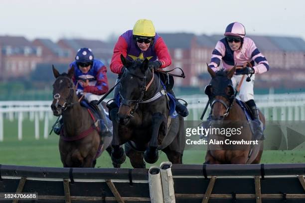 Rex Dingle riding Dashel Drasher clear the last to win The Coral Long Distance Hurdle at Newbury Racecourse on December 01, 2023 in Newbury, England.