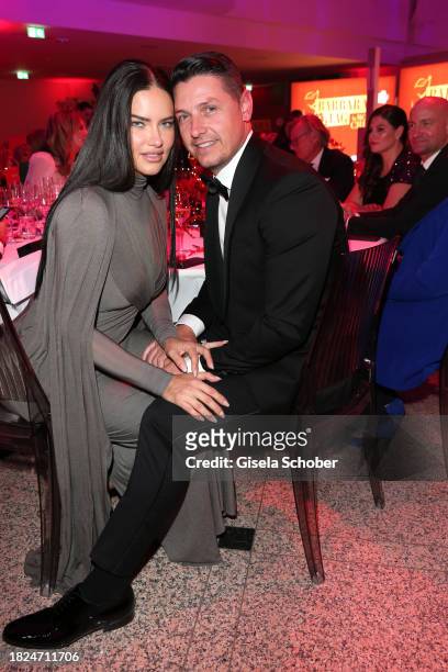Super model Adriana Lima and Andre Lemmers during the 15th Mon Cheri hosts Barbara Tag at Isarpost on December 4, 2023 in Munich, Germany.