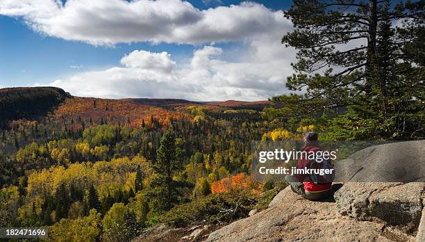 hiker resting and taking in an autumn view. - mn stock pictures, royalty-free photos & images