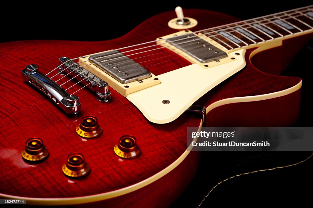 Close up of a red electric guitar
