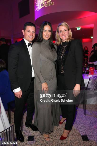 Andre Lemmers, Super model Adriana Lima, Isabella Mandl during the 15th Mon Cheri hosts Barbara Tag at Isarpost on December 4, 2023 in Munich,...