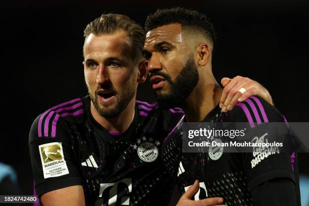 Eric Maxim Choupo-Moting and Harry Kane of Bayern Munich interact following the Bundesliga match between 1. FC Köln and FC Bayern München at...