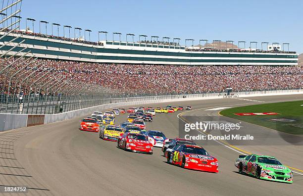 Bobby Labonte leads the pack in his interstate Batteries Chevrolet Monte Carlo at the start of the NASCAR Winston Cup UAW Daimler Chrysler 400 at the...