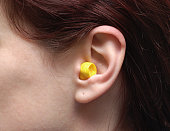 One single ear with a ear plug in it