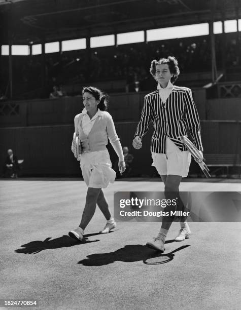 Tennis players Anita Lizana de Ellis of Chile and Patricia Todd of the United States walking onto Centre Court for their match in the Wimbledon...