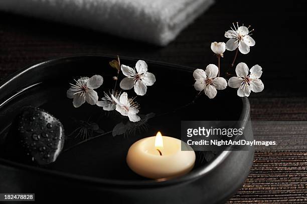 zen spa with floating candle and blossoms - japanese flowers stock pictures, royalty-free photos & images