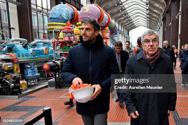 Thomas Bach IOC President and Tony Estanguet Paris 2024 President visit the Paris 2024 Olympic Village construction site on December 01, 2023 in...