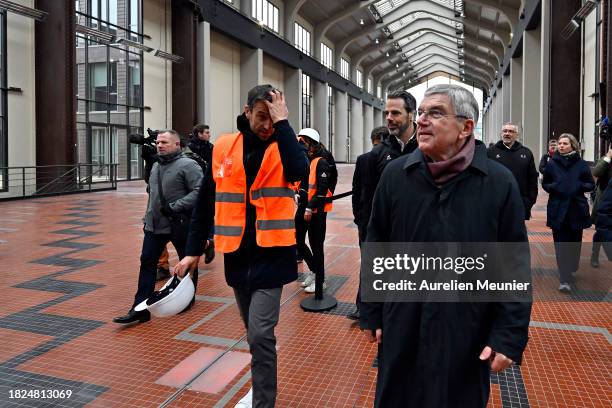 Thomas Bach IOC President and Tony Estanguet Paris 2024 President visit the Paris 2024 Olympic Village construction site on December 01, 2023 in...