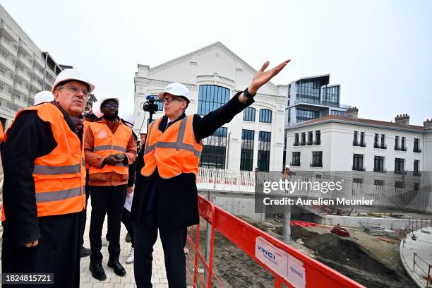 Thomas Bach IOC President visits the Paris 2024 Olympic Village construction site on December 01, 2023 in Paris, France.