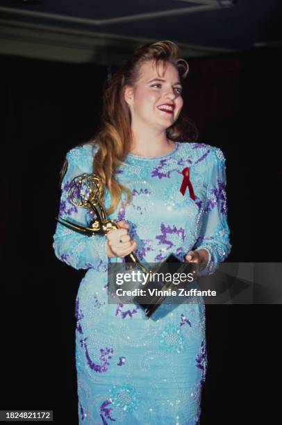 American actress Tricia Cast, wearing a blue dress with purple detail, attends the 1992 Daytime Emmy Awards, held at the Sheraton New York Hotel in...