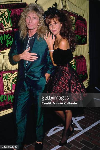 British singer and songwriter David Coverdale and his fiancee, American actress Tawny Kitaen attend the MTV Video Music Awards, held at the Universal...