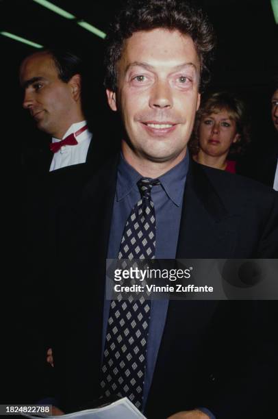 British actor and singer Tim Curry attends the Hollywood premiere of 'The Three Musketeers', held at the Cinerama Dome Theater in Los Angeles,...