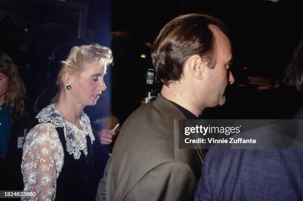 American actress Jill Tavelman with her husband, British singer, songwriter, drummer and actor Phil Collins, attend the Beverly Hills premiere of...