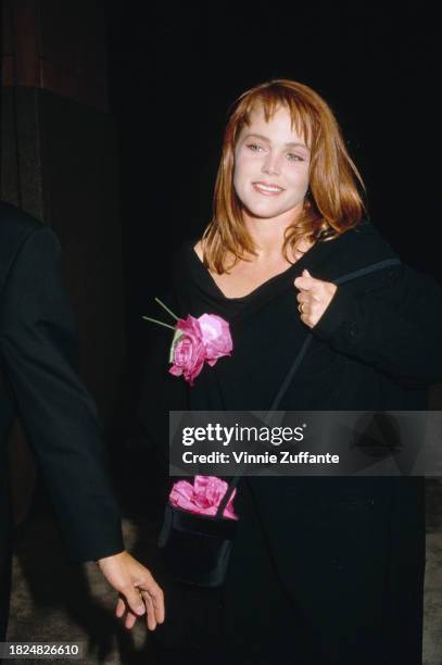 American singer and songwriter Belinda Carlisle, wearing a black v-neck outfit with floral decoration, attends the cocktail reception celebrating...