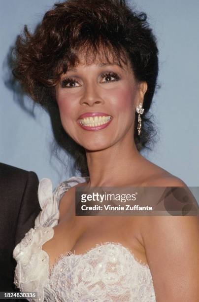 American actress and singer Diahann Carroll, wearing a white lace asymmetric outfit, attends the 39th Annual Primetime Emmy Awards at the Pasadena...