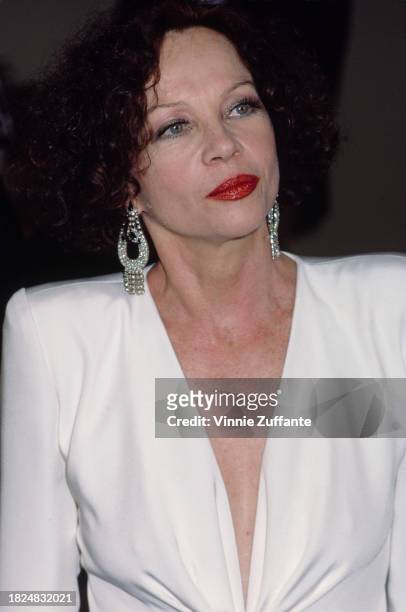 French-American actress and dancer Leslie Caron, wearing a white outfit with a plunging neckline, 5th Annual American Cinema Awards, held at the...
