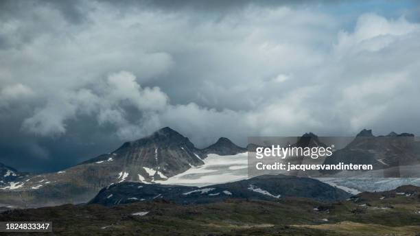 the rough landscape near the sognefjellshytta (mountain cabin) in the jotenheimen nature reserve - moody sky stock pictures, royalty-free photos & images