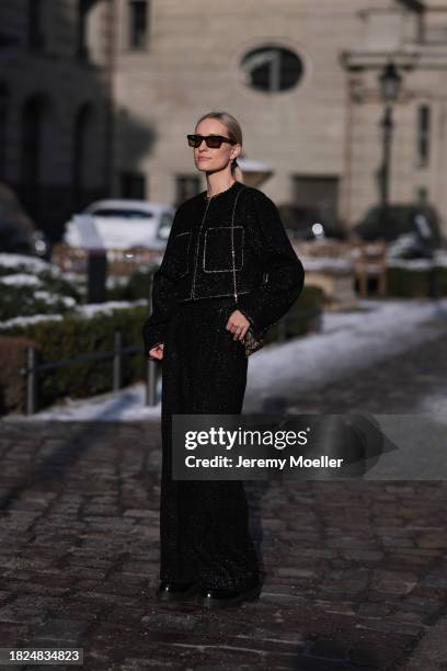 Marlies Pia Pfeifhofer seen wearing YSL brown sunglasses, H&M black boucle glitter blazer jacket, matching black boucle glitter wide leg pants, Louis...