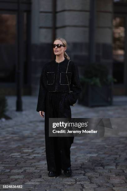 Marlies Pia Pfeifhofer seen wearing YSL brown sunglasses, H&M black boucle glitter blazer jacket, matching black boucle glitter wide leg pants, Louis...