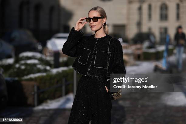 Marlies Pia Pfeifhofer seen wearing YSL brown sunglasses, H&M black boucle glitter blazer jacket, matching black boucle glitter wide leg pants, Louis...