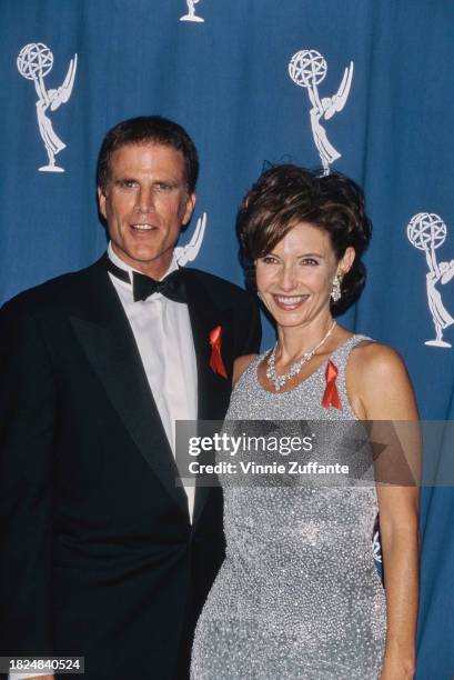 American actor Ted Danson, wearing a tuxedo and bow tie, and his wife, American actress Mary Steenburgen, who wears a silver evening gown in the...