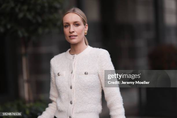 Marlies Pia Pfeifhofer seen wearing Vintage Dior gold statement earrings, H&M cream white boucle cardigan jacket,, on November 30, 2023 in Berlin,...