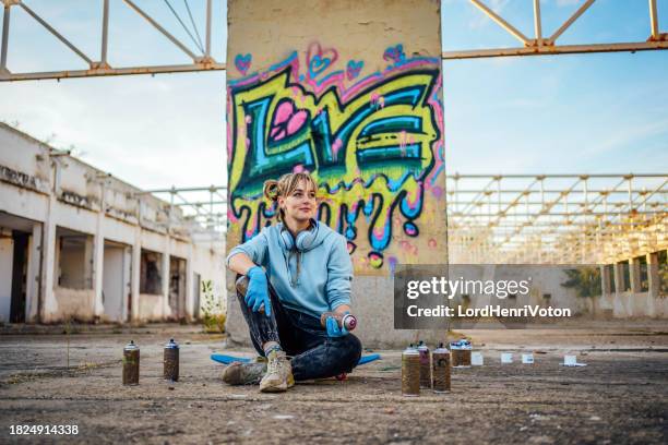 expressing creativity through street art - street artist stock pictures, royalty-free photos & images