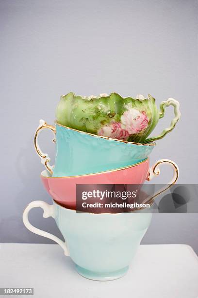 stack of four fine delicate china teacups - multi colored skirt bildbanksfoton och bilder