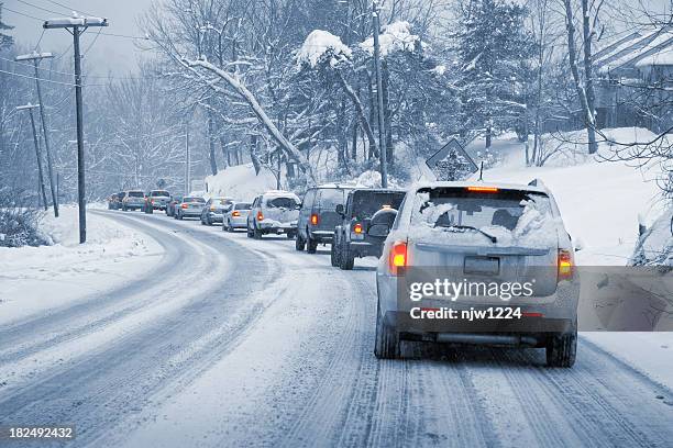 winter driving in snow - icy roads stockfoto's en -beelden