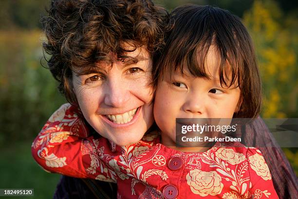 mom and daughter playing together at the prairie - chinese family with one child stock pictures, royalty-free photos & images
