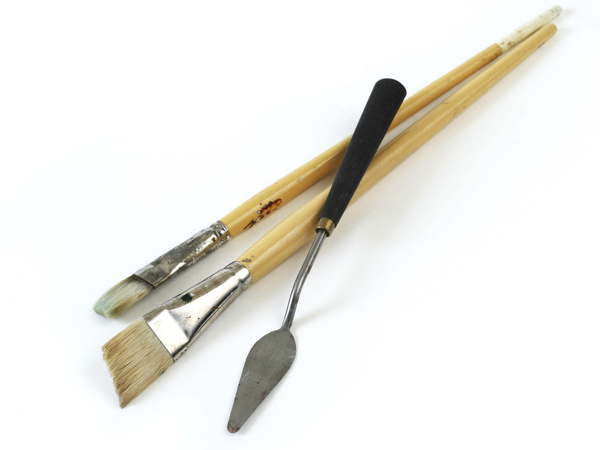 Art supplies. Paint brushes, palette knife. Isolated on white. Vertical. Art supplies. Paint brushes, palette knife. Isolated on white. Vertical.